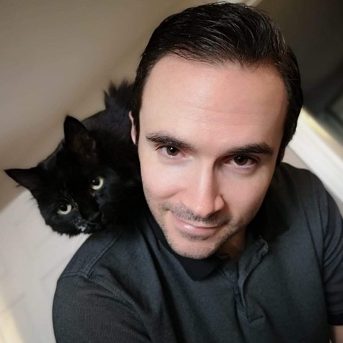 Headshot of Mitch Dickinson with his cat